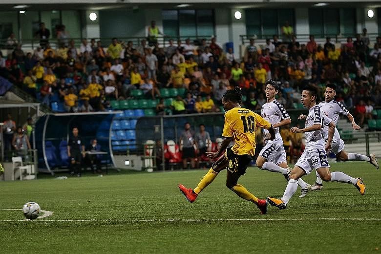 Tampines Rovers winger Jordan Webb scoring the equaliser during the 1-1 AFC Cup draw against Hanoi FC at Jalan Besar Stadium yesterday. The result meant that Hanoi stay top, ahead of the Stags on goal difference.