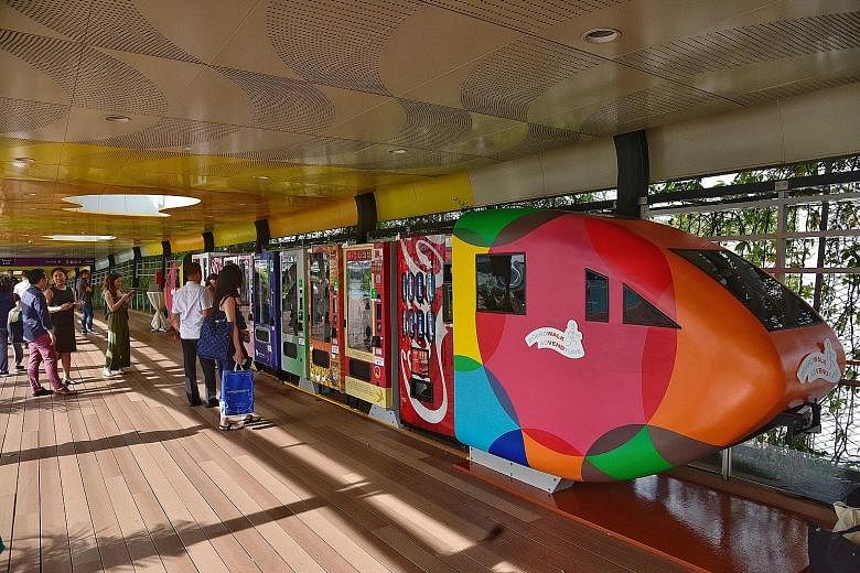 Visitors taking the pedestrian route into Sentosa from VivoCity will now be able to shop for a range of souvenirs, snacks and skincare products round the clock, with the launch of 35 vending machines along the Sentosa Boardwalk yesterday. Local cockt