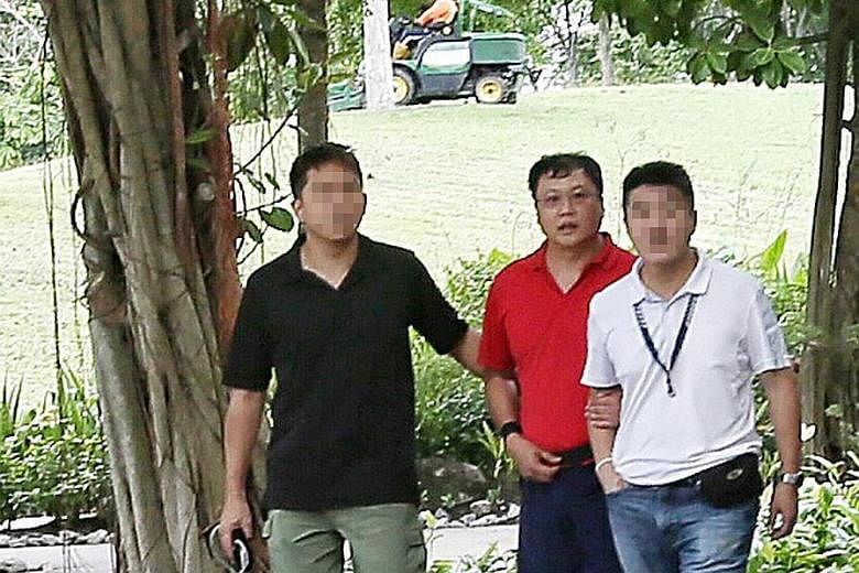 Above: The court heard that Ms Cui Yajie was strangled by Leslie Khoo Kwee Hock in his car at Gardens by the Bay in 2016. Khoo then burned her body in Lim Chu Kang Lane 8. Right: Khoo (in red) being led to the crime scene at Gardens by the Bay after 