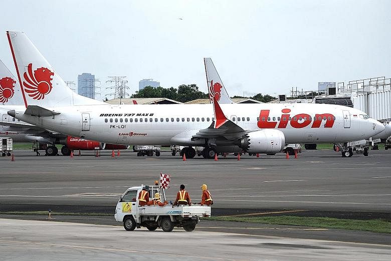 A Lion Air Boeing 737 Max 8 aircraft at Soekarno-Hatta International Airport in Indonesia on Tuesday. China and Indonesia were the first countries to order local carriers to ground their Boeing 737 Max 8 aircraft, after the plane was involved in two 