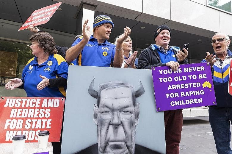 Protesters outside the County Court of Victoria in Australia yesterday after George Pell, 77, was sentenced to six years in jail for sexually abusing two choir boys in Melbourne in the 1990s. Pell, who will be registered as a sex offender for the res