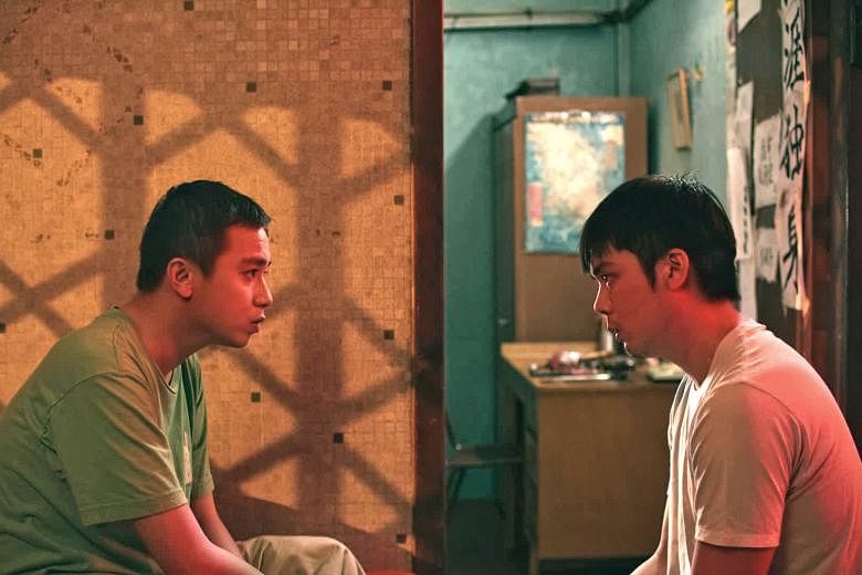 Didi (played by Ernest Chong, above left) puts his life on hold to look after his older autistic brother, Wen Guang (played by Kyo Chen), in Guang.