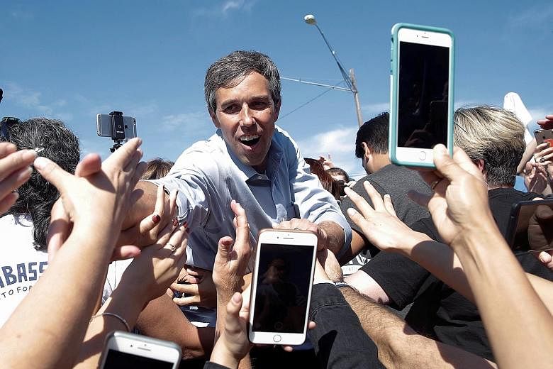 Mr Beto O'Rourke greeting supporters at a campaign rally for the Senate in Austin, Texas, last year. Though he narrowly lost the contest to Republican Ted Cruz, Mr O'Rourke managed to build a nationwide following with his unconventional and optimisti