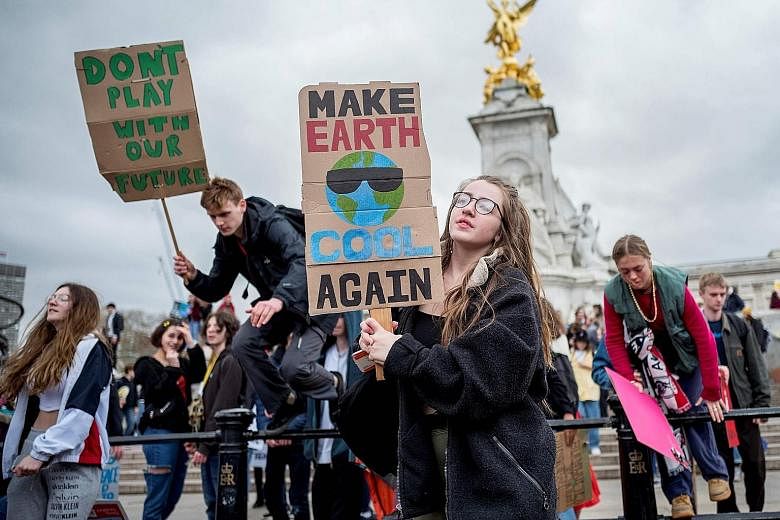 Students outside Buckingham Palace in central London taking part in the Global Climate Strike yesterday.