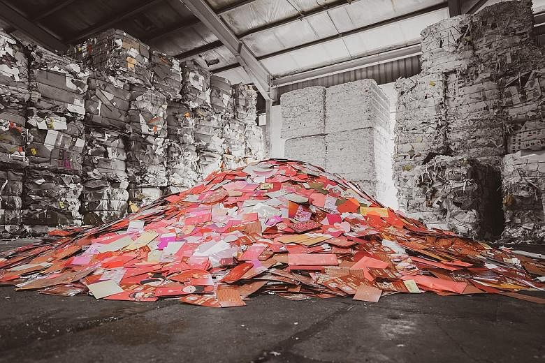 Red packets at Tay Paper Recycling in Gul Avenue. DBS says it has collected nearly 3 tonnes of them, and they will be turned into paper pulp and processed into recycled paper rolls or used to create new paper products.