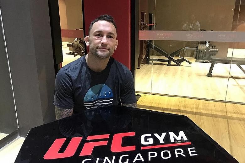 Frankie Edgar, who at 37 has spent the most time in the UFC octagon, at the opening of the first UFC Gym Singapore yesterday. He is in line to challenge Max Holloway for the lightweight belt when he recovers from injury.