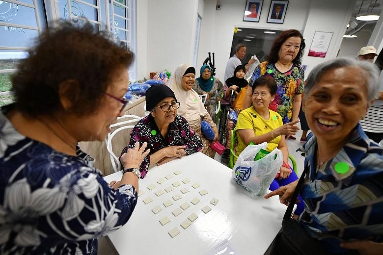 Seniors playing the Finding 114 memory game at THK Seniors Activity Centre @ Fengshan 114.