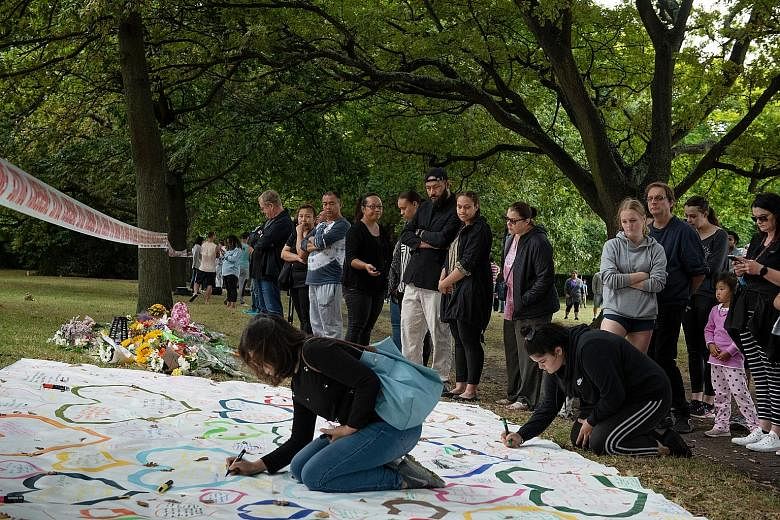 Societies need to come down hard on Islamophobic people, says Minister for Law and Home Affairs K. Shanmugam. Mourners gathering near Al Noor Mosque in Christchurch, New Zealand, yesterday as the country grappled with grief and horror a day after 49 