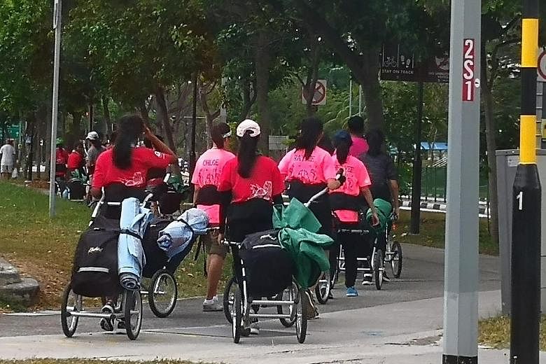 A photo showing a group of students pulling hiking trailers behind them while on an Outward Bound Singapore expedition sparked debate.