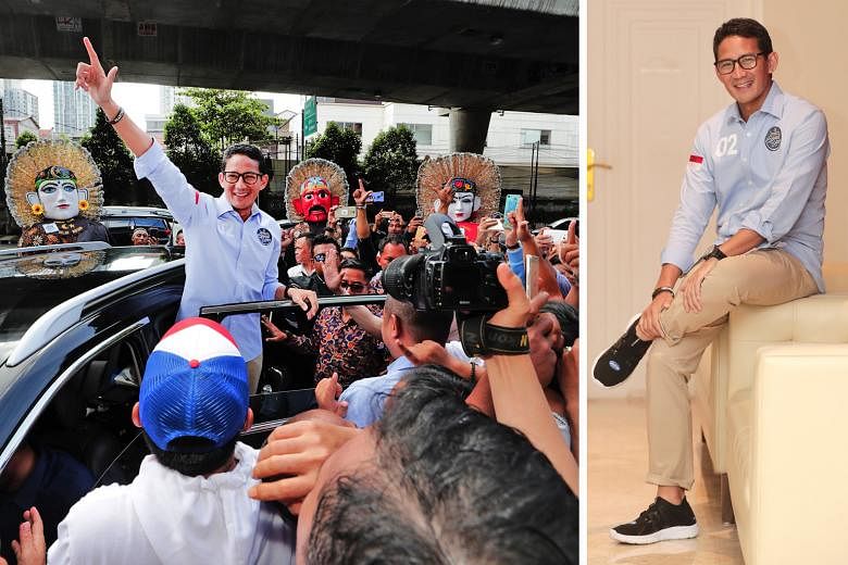Vice-presidential candidate Sandiaga Uno waving to the crowd in Kemang on Feb 17 (left). He had attended the launch of an "I'm SandiUno" app and met youth volunteers and supporters at a cafe there. Later at an interview in his camp's media centre (be