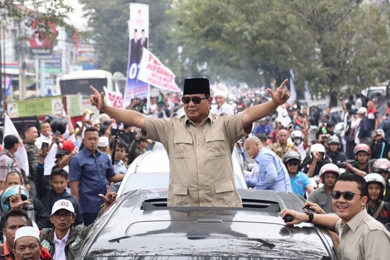 Presidential candidate Prabowo Subianto on a visit to Cianjur, in West Java. His campaign has so far zeroed in on bread-and-butter issues, a potential weak spot for Mr Joko. President Joko Widodo has not lost an election since he entered politics 15 