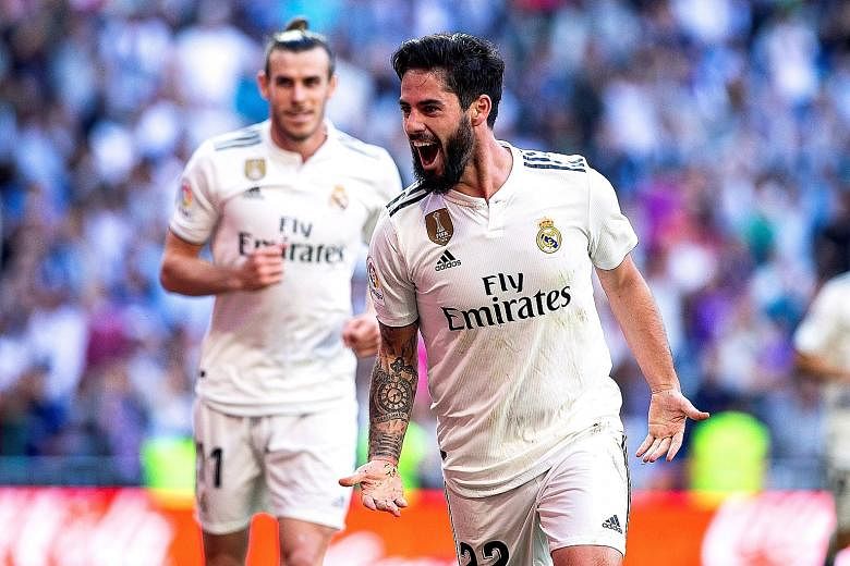 Isco celebrating after scoring the first of Real Madrid's two goals against Celta Vigo at the Santiago Bernabeu stadium on Saturday.