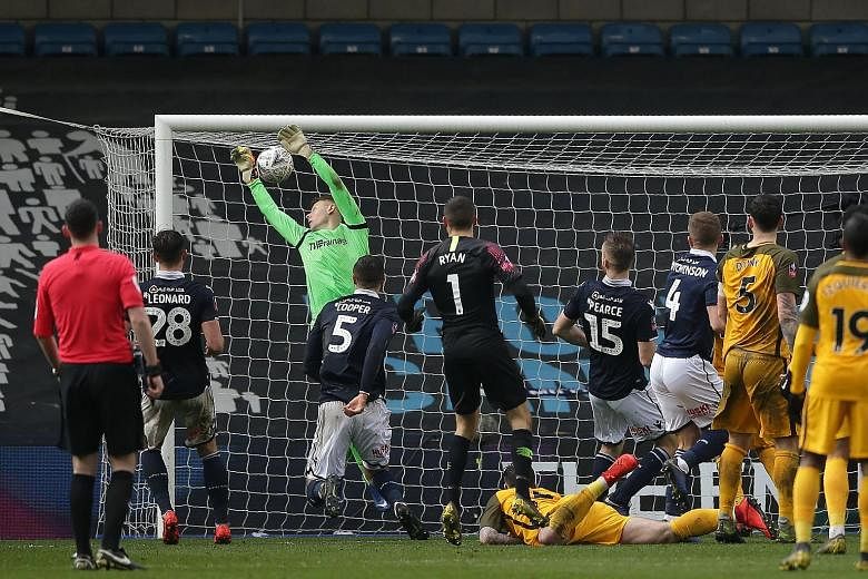 Millwall goalkeeper David Martin fluffing a free kick from Brighton's Solly March in the fifth minute of stoppage time, which earned the English south coast side a 2-2 draw in their FA Cup quarter-final and forced extra time at the Den in London yest