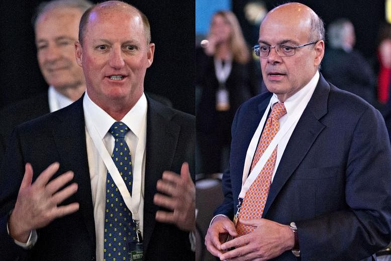 Berkshire Hathaway vice-chairmen Greg Abel (left) and Ajit Jain are considered the leading candidates to succeed Mr Warren Buffett as the conglomerate's chief executive.