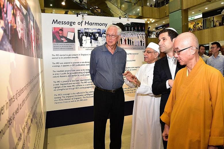 (From left) Emeritus Senior Minister Goh Chok Tong, who is patron of the Inter-Religious Organisation, Singapore with religious leaders, Imam Habib Hassan Al-Attas, Mr Ben J. Benjamin and Venerable Seck Kwang Phing, at the launch yesterday of an exhi