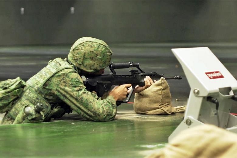 Soldiers graded PES E, who typically serve as administrative support or supply assistants, can now try out the SAR21 assault rifle using an indoor virtual firing range.