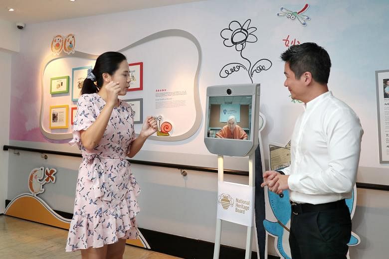 Mr Alvin Tan, assistant chief executive of the National Heritage Board, and Ms Lu Cai Xia, assistant curator of the Sun Yat Sen Nanyang Memorial Hall, with the remote-controlled Telepresence Robot. With the robot, a visitor needs only a device with a