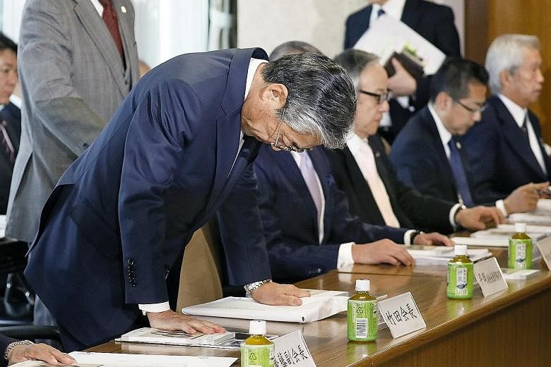 Tsunekazu Takeda, the head of the Japanese Olympic Committee (JOC), bowing before a JOC board meeting in Tokyo yesterday. He is being investigated by French authorities for corruption linked to the 2020 Olympic Games bid.