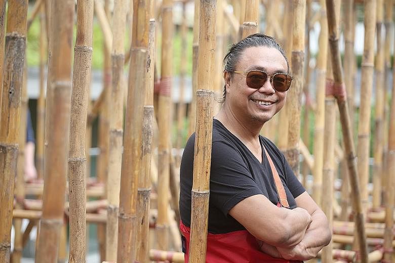 Artist Rirkrit Tiravanija with his bamboo maze installation on the roof garden of National Gallery Singapore last year.