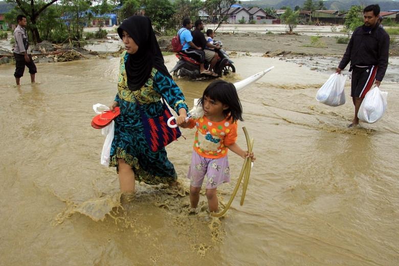 Indonesia Flood Death Toll Tops 100, Dozens Still Missing | The Straits ...