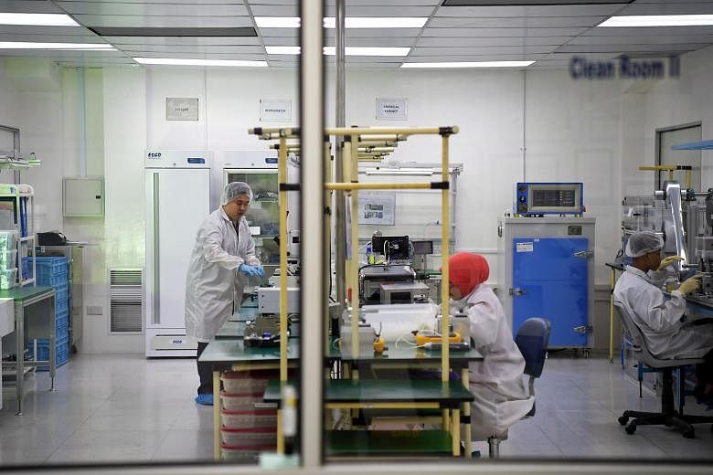 Employees working in the assembly department of a firm which designs and manufactures high-value medical devices and lab equipment. A report released by Euromonitor International revealed that an overwhelming number of respondents felt that growth wo