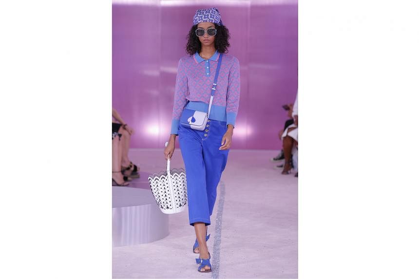 Nicola Glass' first collection for Kate Spade includes flowing satin pieces sporting puff sleeves and subtle ruffles, cropped knits and crossbody bags with spade-shaped twist locks.