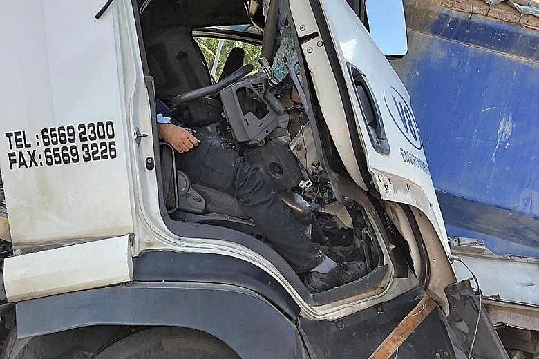 The driver was trapped in his seat after his truck rammed into one that was stationary. He was subsequently rescued with the use of hydraulic tools and taken to hospital.
