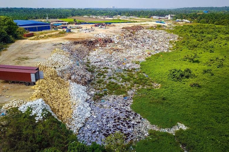 Shortly after the authorities found chemical waste dumped in an oil palm estate in Bukit Teh (above) in Penang, a sprawling illegal plastic dump site was discovered nearby.