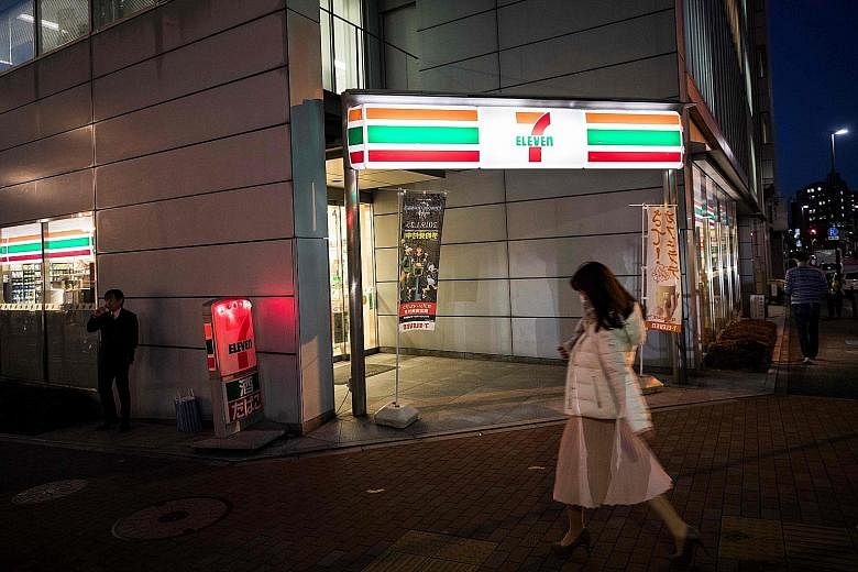 A 7-Eleven convenience store in Tokyo. Store owners are finding it increasingly hard to hire enough workers. Many owners say they have to work long hours themselves to keep their stores open 24 hours.