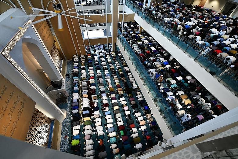 Muslims praying at the Masjid Darul Ghufran in Tampines yesterday. Imams across Singapore underscored the importance of forgiveness in Friday prayer sermons, saying: "Extending forgiveness to those who have hurt us is far more powerful than any bulle
