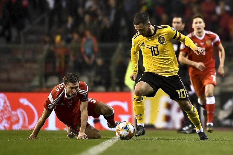 Belgium captain Eden Hazard giving Russia's Kirill Nababkin the slip during their Euro 2020 qualifying match in Brussels, which the hosts won 3-1.