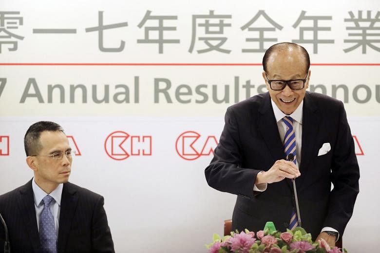 CK Hutchison Holdings' then chairman Li Ka Shing, accompanied by his son Victor, speaking at a Hong Kong news conference in March last year to announce his retirement and intention to hand over the top position to Mr Victor Li. In the year since his 