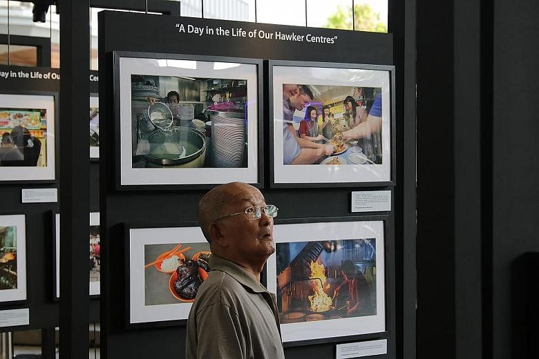 Photos for the #OurHawkerCulture photography contest were on display yesterday at Bedok Town Square, alongside a separate photography showcase on what 24 hours at five different hawker centres here look like.
