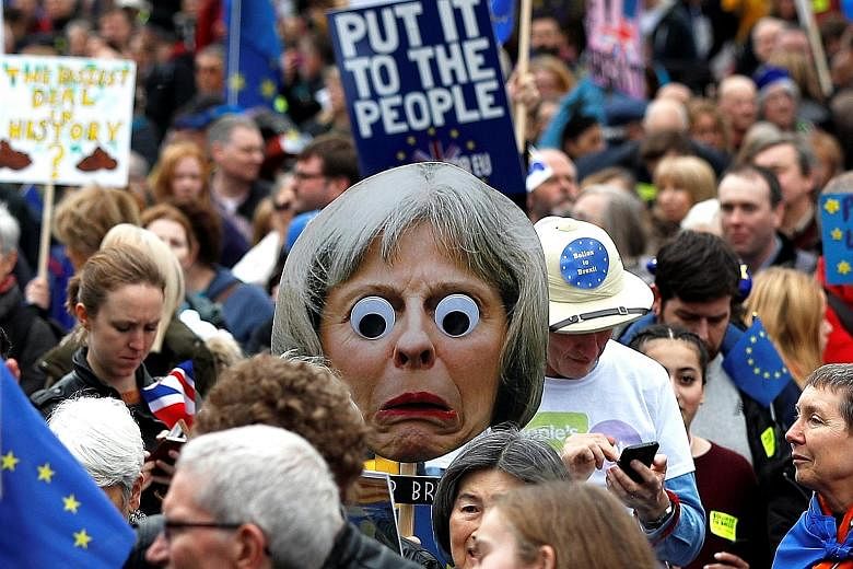 Pro-EU demonstrators in the "People's Vote" march in London yesterday. Organisers said hundreds of thousands of people were in the crowd as it began to march.