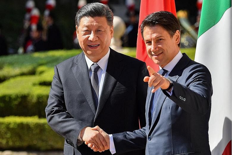China's President Xi Jinping with Italian President Sergio Mattarella in Rome yesterday. The Chinese leader and his wife were serenaded at a state dinner last Friday by singer Andrea Bocelli. China's President Xi Jinping being welcomed by Italian Pri