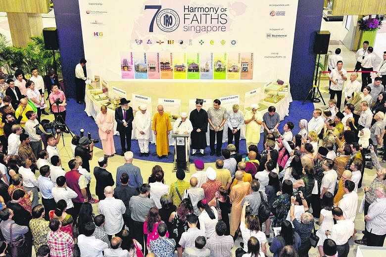Interfaith prayers being held during the 70th anniversary of the founding of Inter-Religious Organisation, Singapore at Far East Plaza on March 18 last year. The Government has long stressed the values of multiculturalism and interfaith dialogue and 