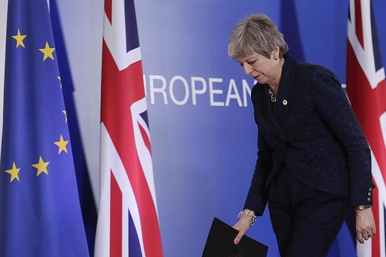British Prime Minister Theresa May leaving at the end of the Article 50 session at the European Council in Brussels, Belgium, on Thursday. According to reports by the British media, Mrs May could be replaced by an interim leader who would lead Britai