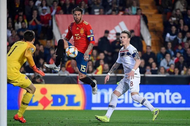 Spain's defender Sergio Ramos challenging Norway goalkeeper Rune Jarstein and midfielder Stefan Johansen during their Euro 2020 qualifier at the Mestalla Stadium in Valencia. The Real Madrid man delivered the winner with a "Panenka" spot kick in the 