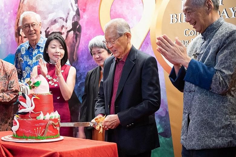 Mr Ong Pang Boon cutting his birthday cake with (from left) Emeritus Senior Minister Goh Chok Tong, Fengshan MP Cheryl Chan, who is the niece of Mr Ong's late wife, Mr Ong's eldest daughter Ong Juey Ming, and Prime Minister Lee Hsien Loong at Mr Ong'