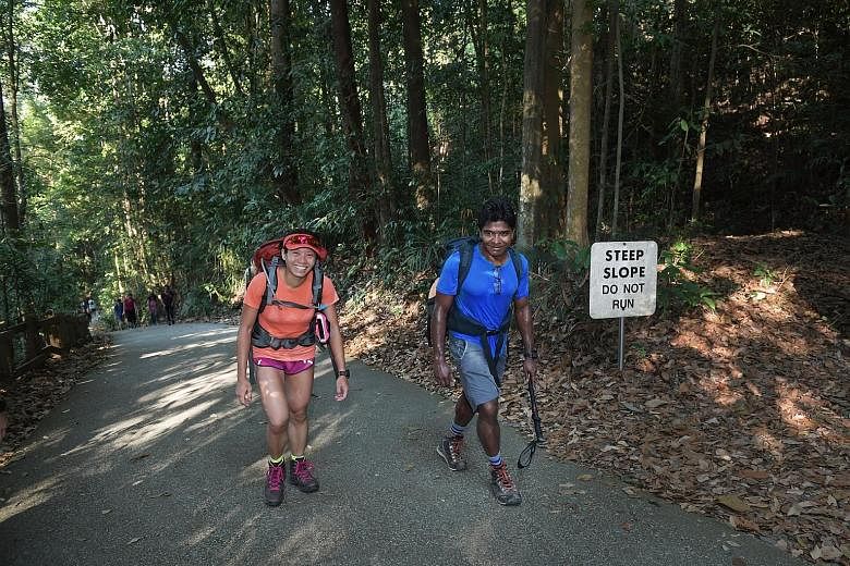 Mr Anandan Bala and Ms Sim Phei Sunn training at Bukit Timah Hill recently in preparation for their Mount Everest climb. They are due to be at the 5,400m Everest Base Camp next month and expect to reach the top in mid-May.
