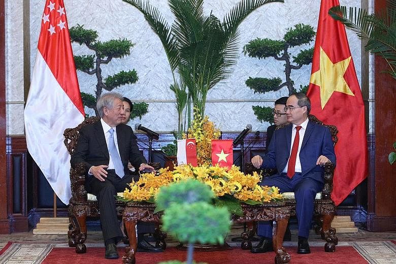Singapore Deputy Prime Minister and Coordinating Minister for National Security Teo Chee Hean having talks with Ho Chi Minh City party secretary Nguyen Thien Nhan in Vietnam's largest city yesterday.