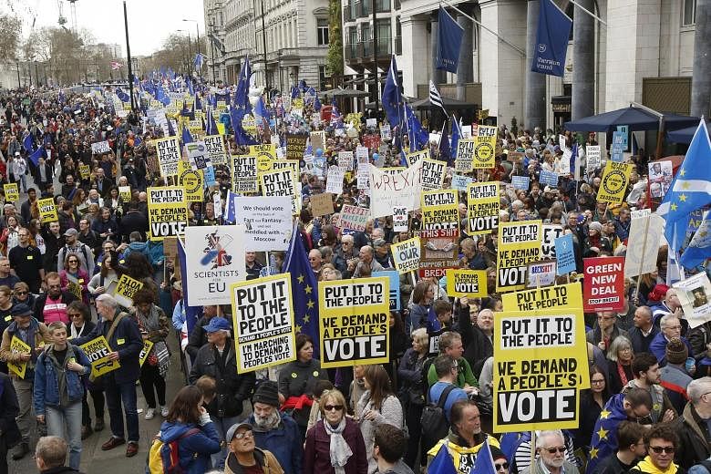 Demonstrators marching in London last Saturday calling for a "People's Vote" on British Prime Minister Theresa May's Brexit deal. A poll released last Thursday found that if Parliament rejects Mrs May's deal for a third time, 46 per cent of responden