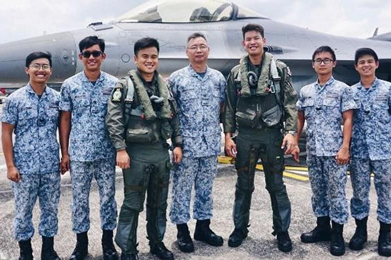 The two pilots - Major Jireh Ang and Captain Jonathan Ow Hsien-Kyn (third and fifth from left) - who flew the fighter jets scrambled yesterday, with their RSAF 143 Squadron colleagues (from left) Third Sergeant Melvin Chan Zhong Jun, Military Expert 