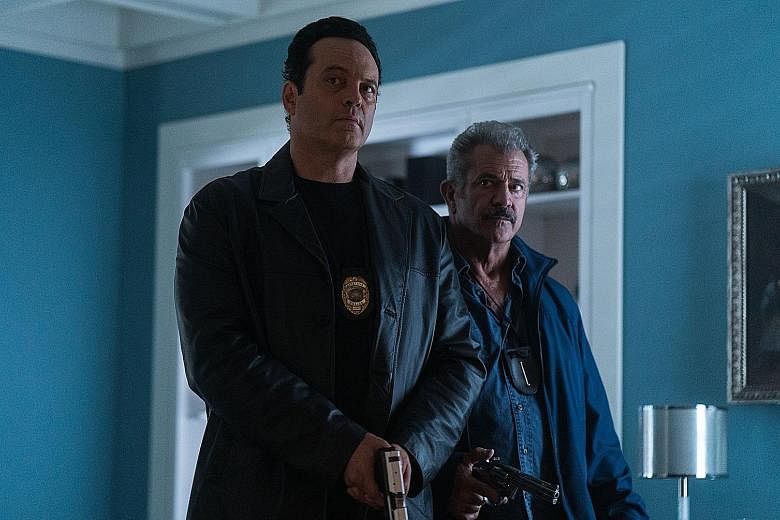 Vince Vaughn (above left) and Mel Gibson play crooked cops who make a mistake on the job.