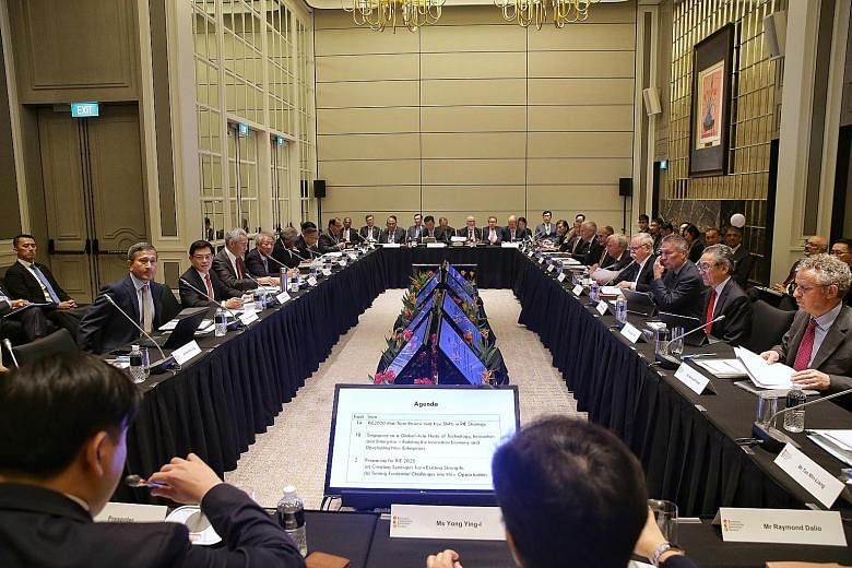 Prime Minister Lee Hsien Loong (middle of left row) chairing the Research, Innovation and Enterprise Council meeting at The St Regis Singapore hotel yesterday. With him were Foreign Minister Vivian Balakrishnan, Finance Minister Heng Swee Keat, Deput