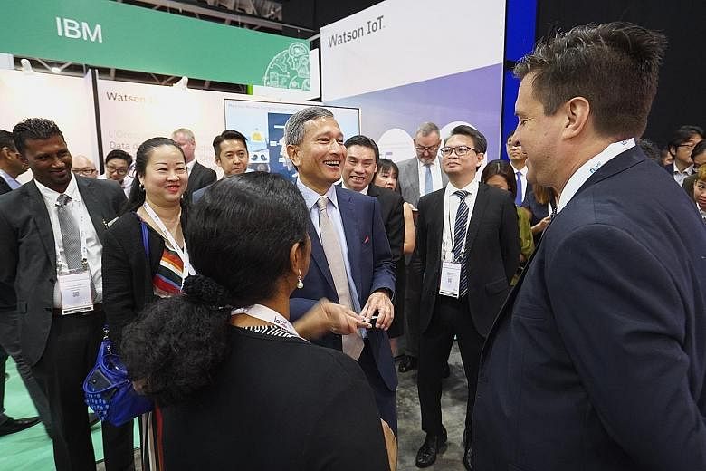 Minister for Foreign Affairs and Minister-in-charge of the Smart Nation initiative Vivian Balakrishnan with delegates at the IoT Asia conference yesterday. In his speech, he underscored the importance of revising legislation in the light of developin