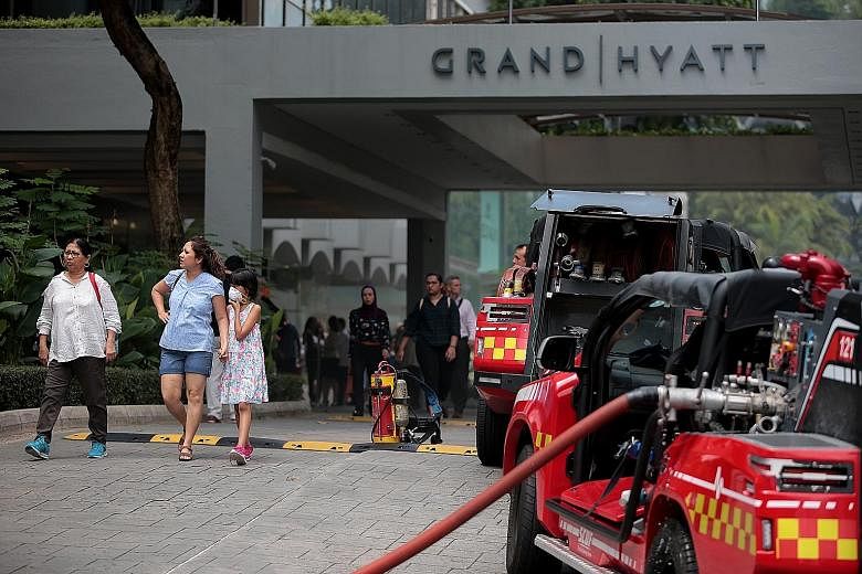 Clockwise from left: About 500 people were evacuated after the fire broke out. At least three Singapore Civil Defence Force vehicles were at the scene. The fire started in the kitchen of Mezza9, on the second floor.