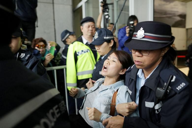 A protester being arrested by the police after storming the Hong Kong government's headquarters earlier this month over proposed changes to the city's extradition laws. After local and foreign business chambers, among others, called on the government
