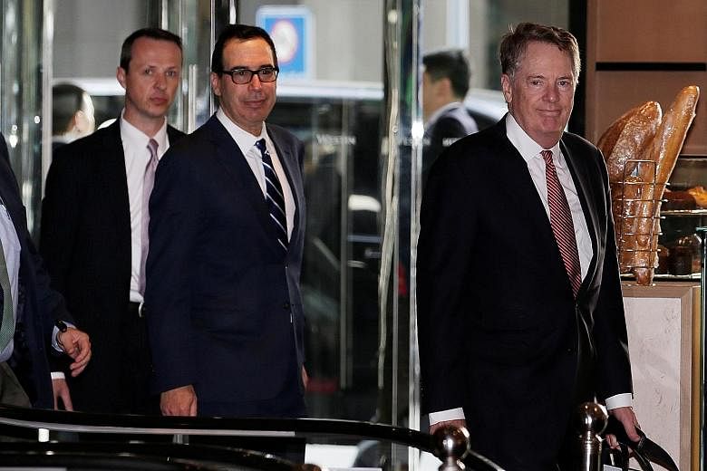 US Treasury Secretary Steven Mnuchin (middle) and US Trade Representative Robert Lighthizer (right) arriving in Beijing yesterday for a new round of trade talks. The duo and China's top economic official Liu He have "made some progress" on trade afte