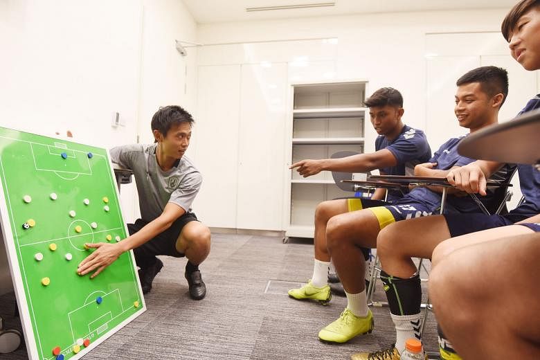 Tampines Rovers' head coach-in-waiting Gavin Lee discussing tactics with his players as they prepare for today's SPL match against Albirex Niigata.